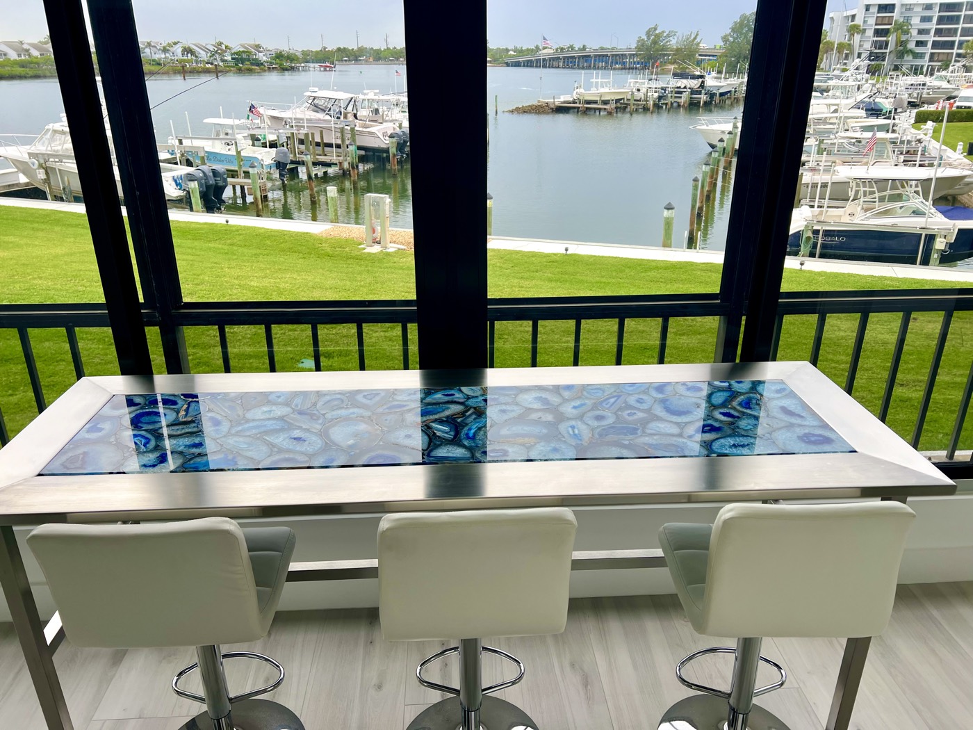 Counter seating on the newly closed-in terrace, looking out over the marina.