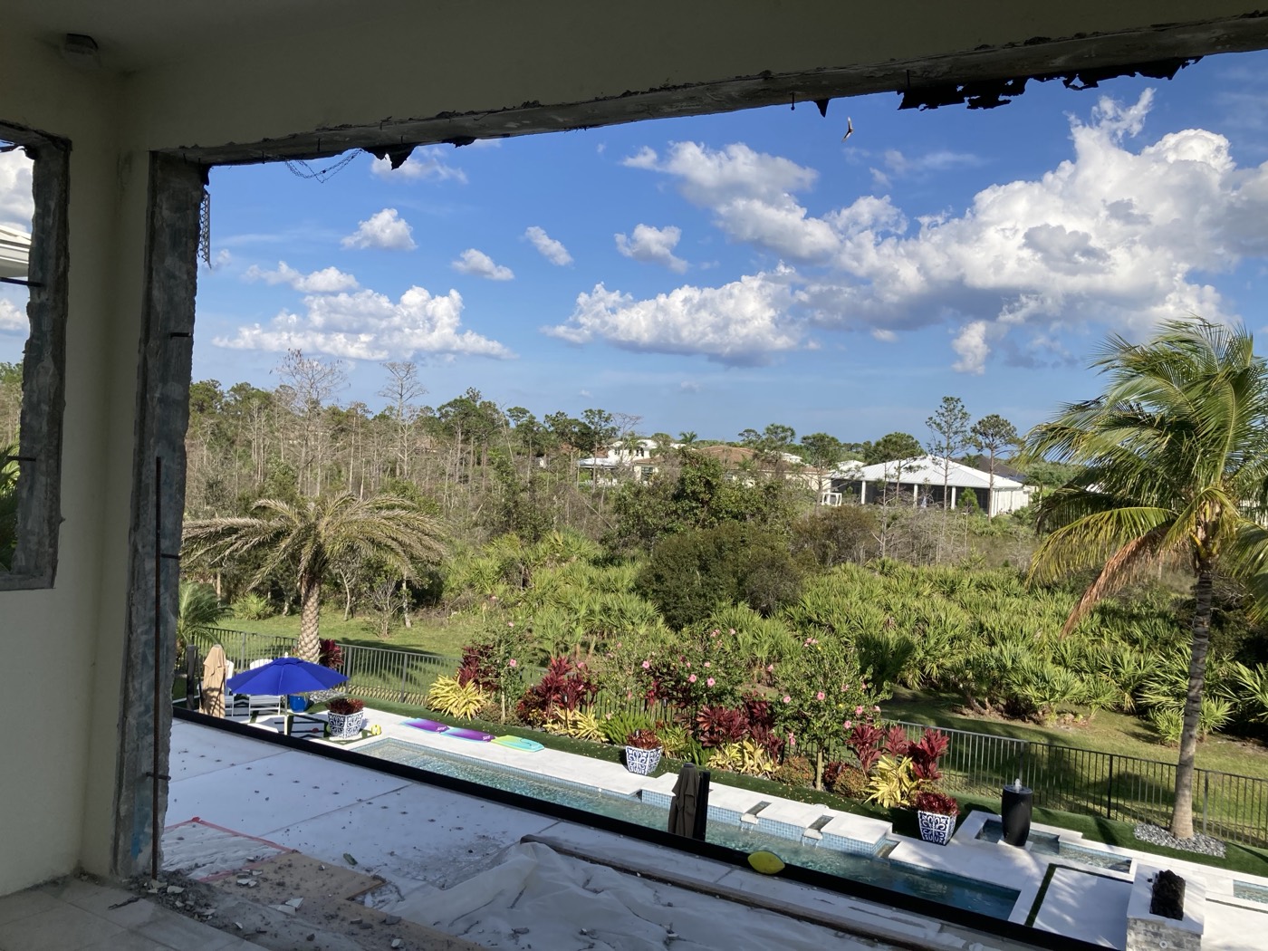 The patio opened up, looking out over the pool and the preserve beyond.