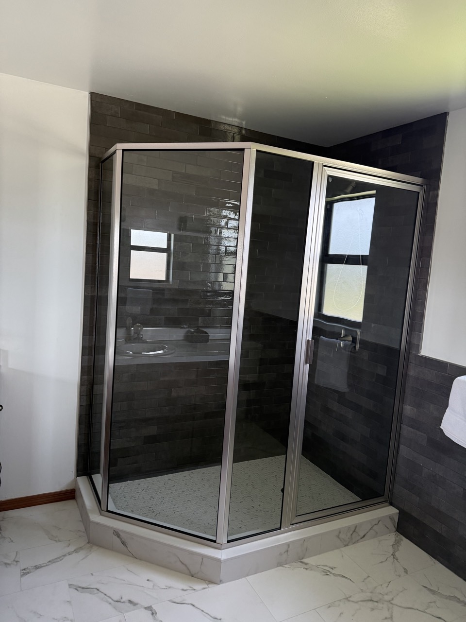 The rebuilt master shower, with new tile, glass and finishes.