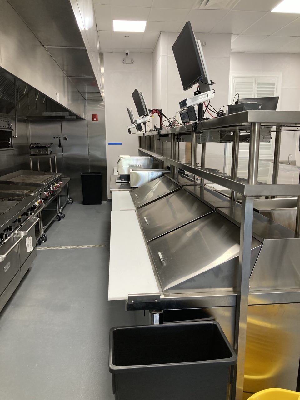 Stainless prep and expo stations along the cook line.