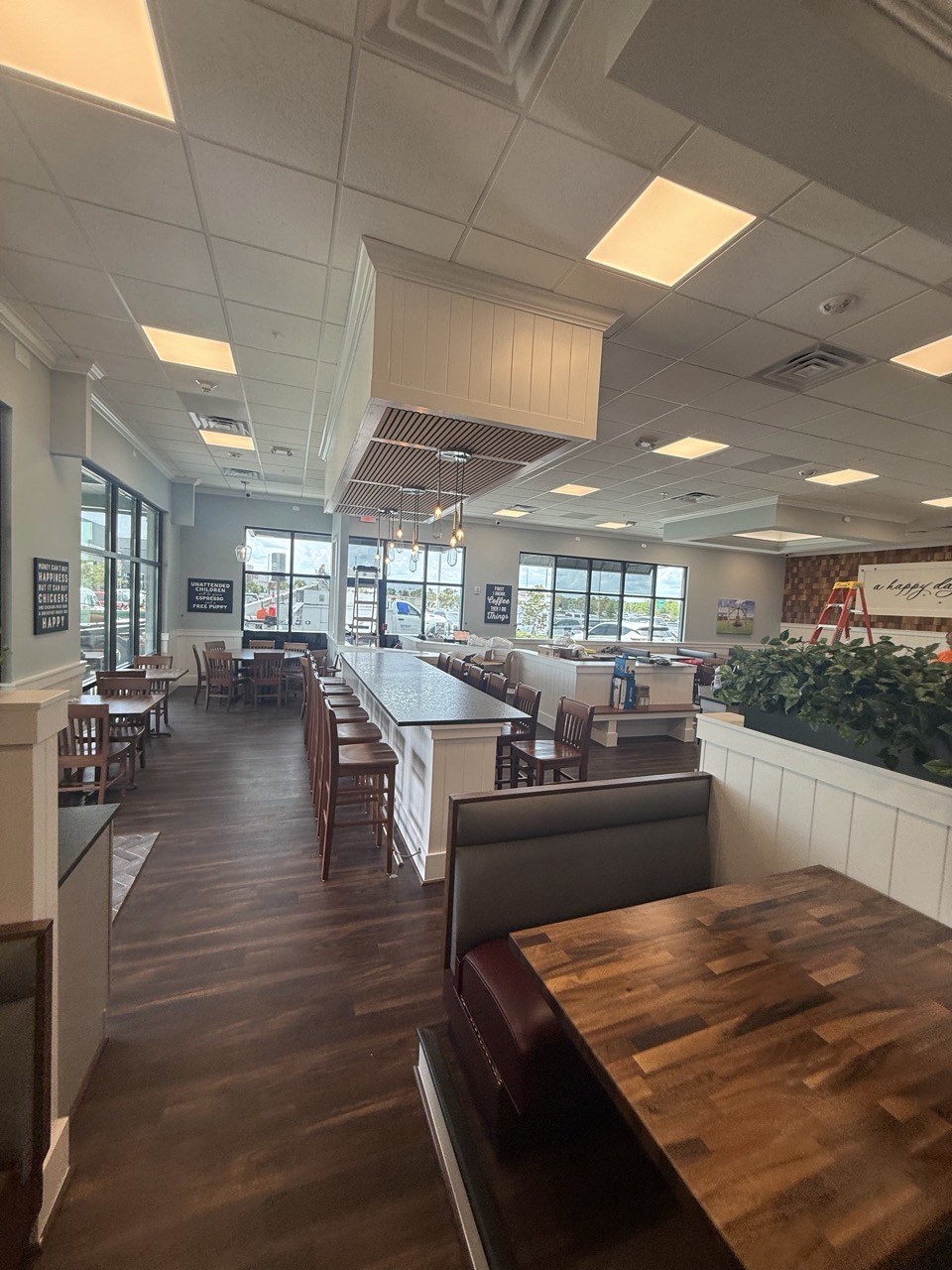 The finished dining room, with the counter seating, booths and pendant lighting installed.