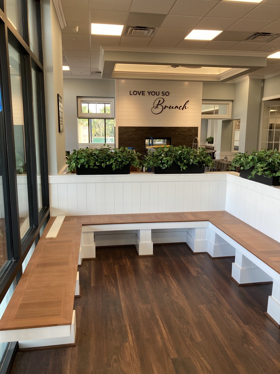 The waiting area, with built-in bench seating and planters.
